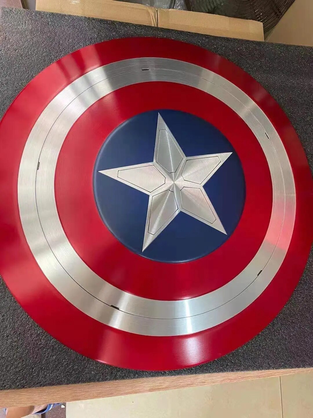 Falcon Captain America shield full front view on tabletop