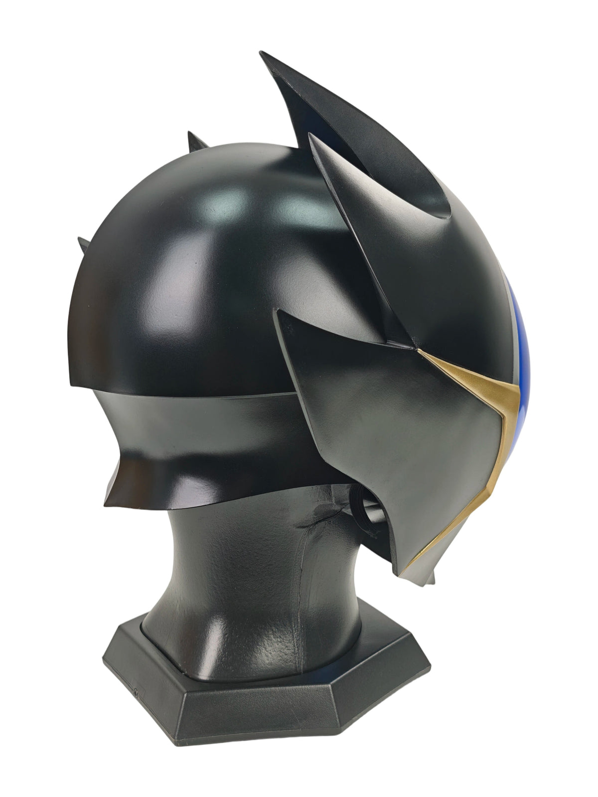 Lelouch Zero helmet right three-quarter view with blue visor, silver crest, gold trim, and black base