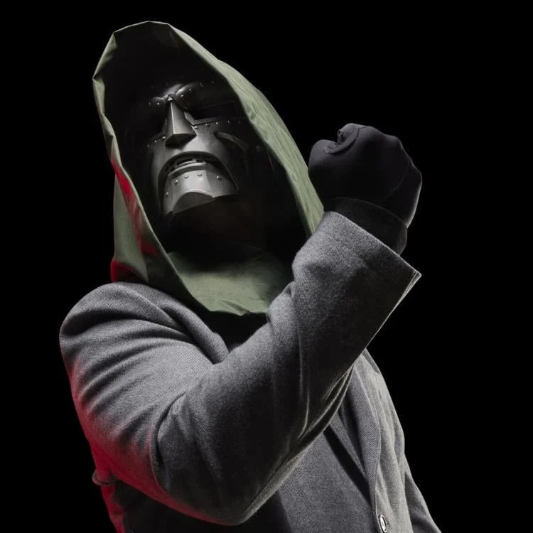 Cosplayer wearing Doctor Doom helmet with green hood