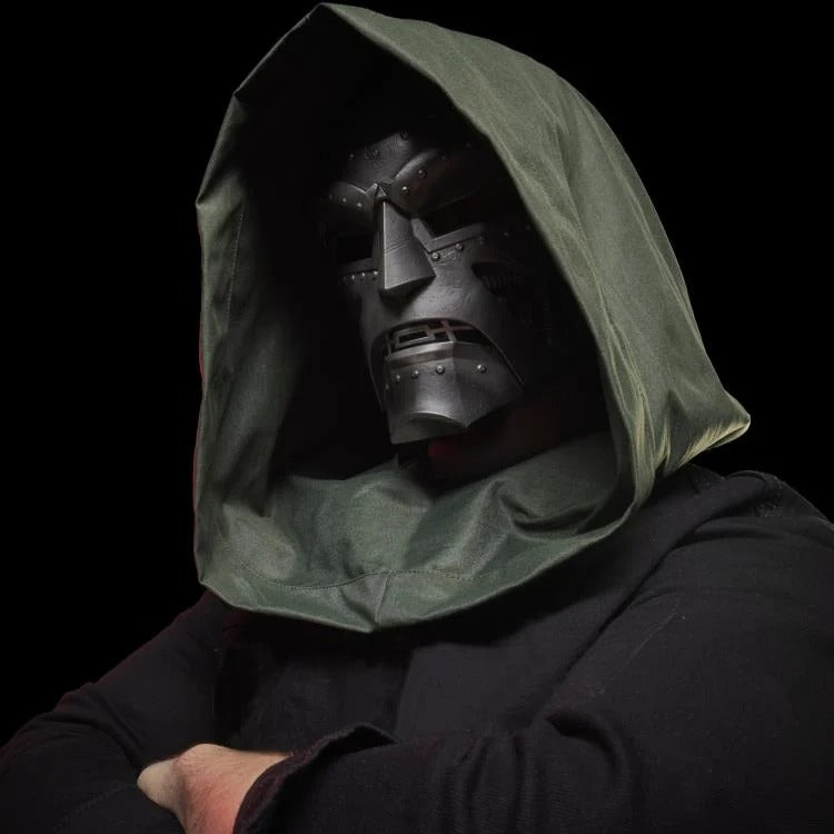 Cosplayer wearing hooded Doctor Doom helmet, side view