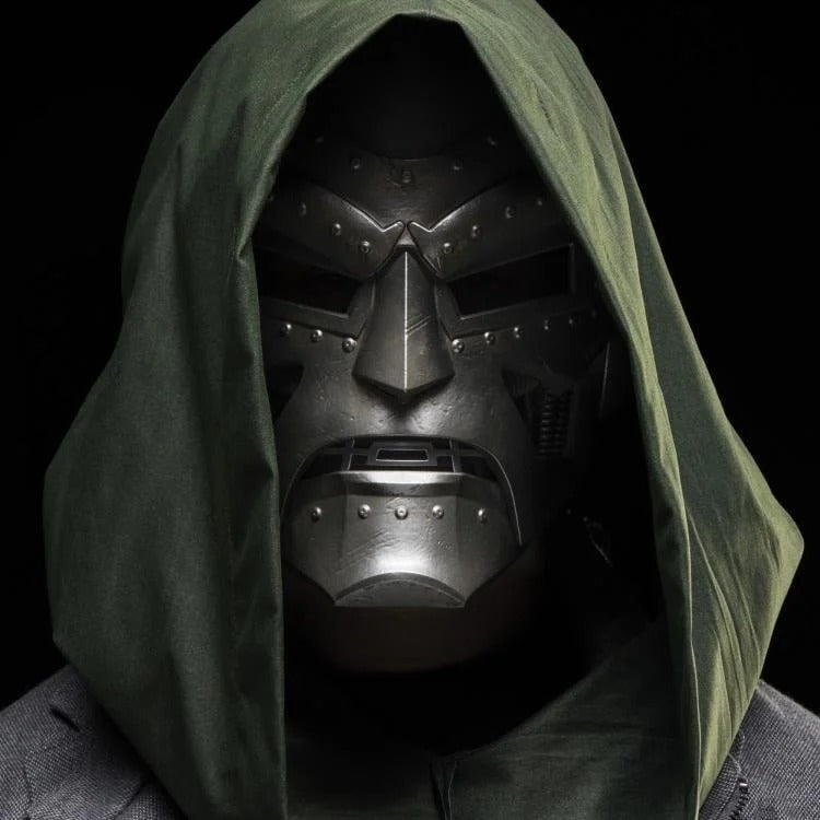 Cosplayer wearing hooded Doctor Doom helmet, front view