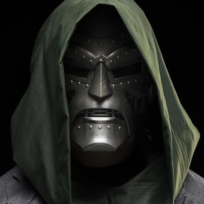 Cosplayer wearing hooded Doctor Doom helmet, front view