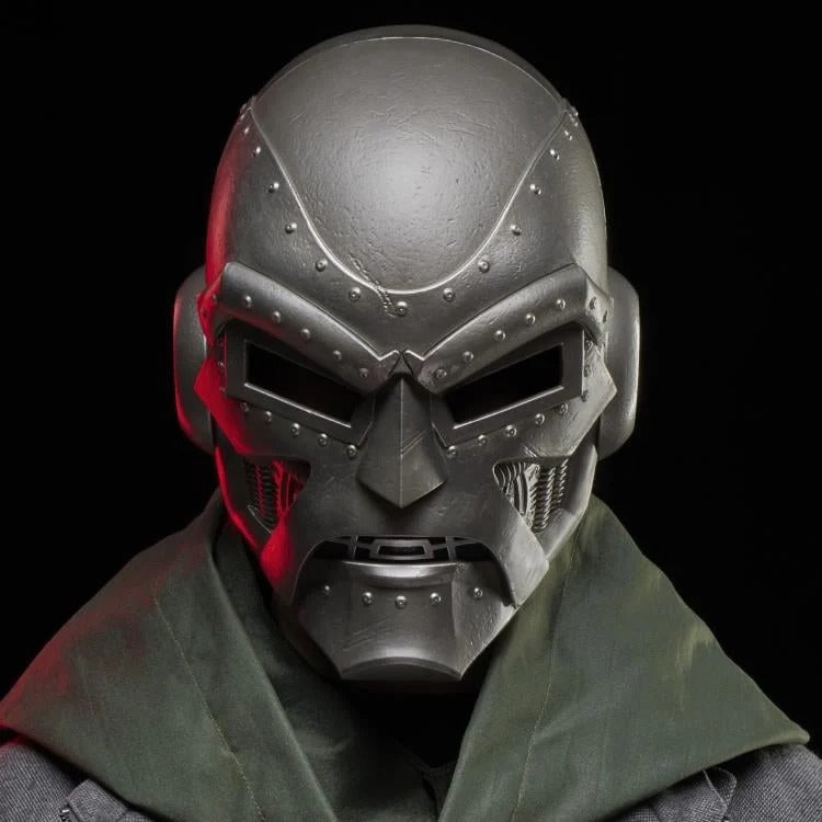 Doctor Doom helmet worn with green hood around the shoulders