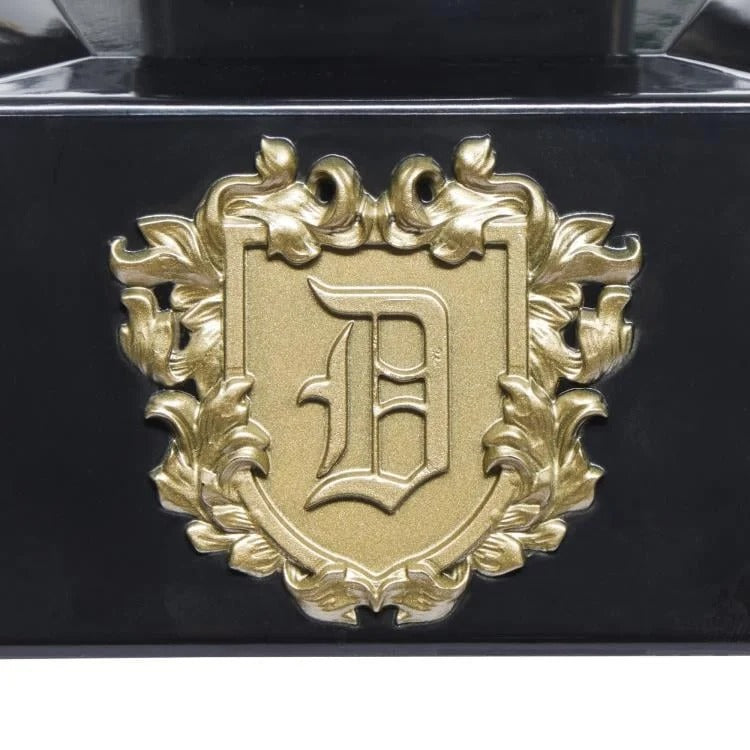 Gold Doctor Doom crest detail on the helmet display stand