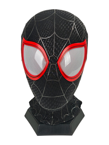 Miles Morales black Spider-Man mask front view with red eye frames, white mesh lenses, raised web pattern, and black stand