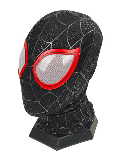 Miles Morales black Spider-Man mask three-quarter view with red eye frame, white mesh lens, web texture, and stand