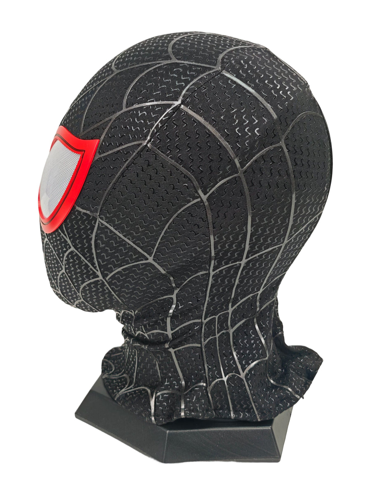 Miles Morales black Spider-Man mask opposite side view with red lens edge, web texture, and black display stand