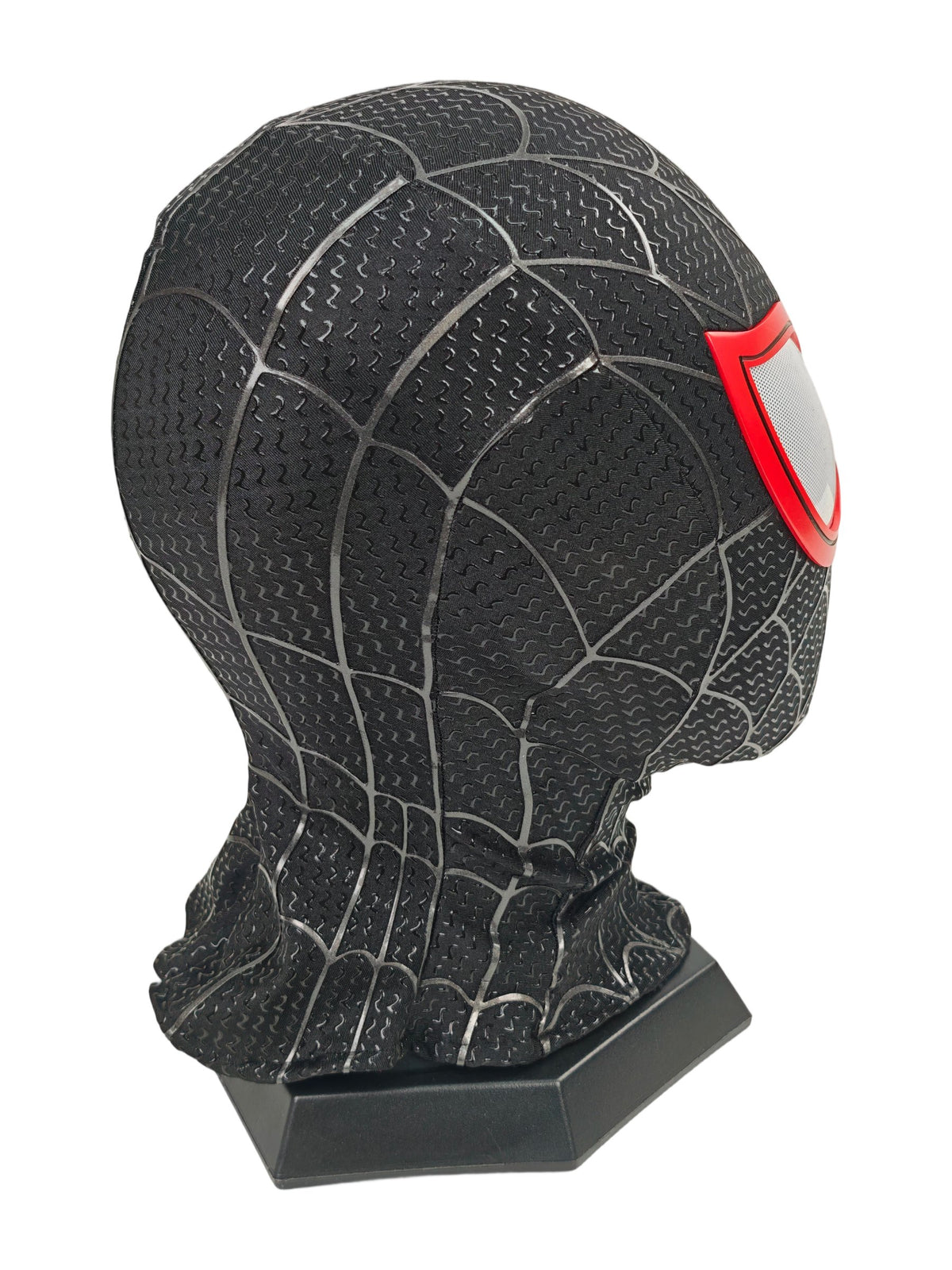 Miles Morales black Spider-Man mask rear three-quarter view with web panels, red lens edge, and black stand