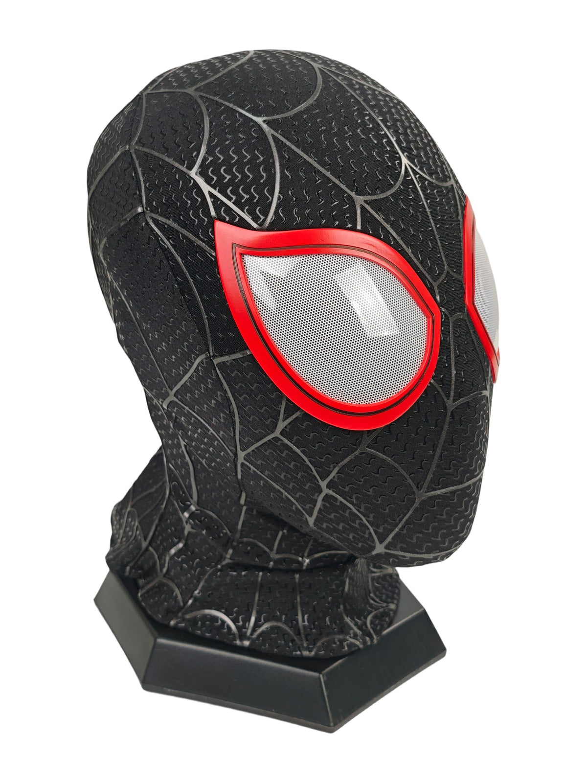 Miles Morales black Spider-Man mask angled front view with red eye frame, white mesh lens, web pattern, and stand