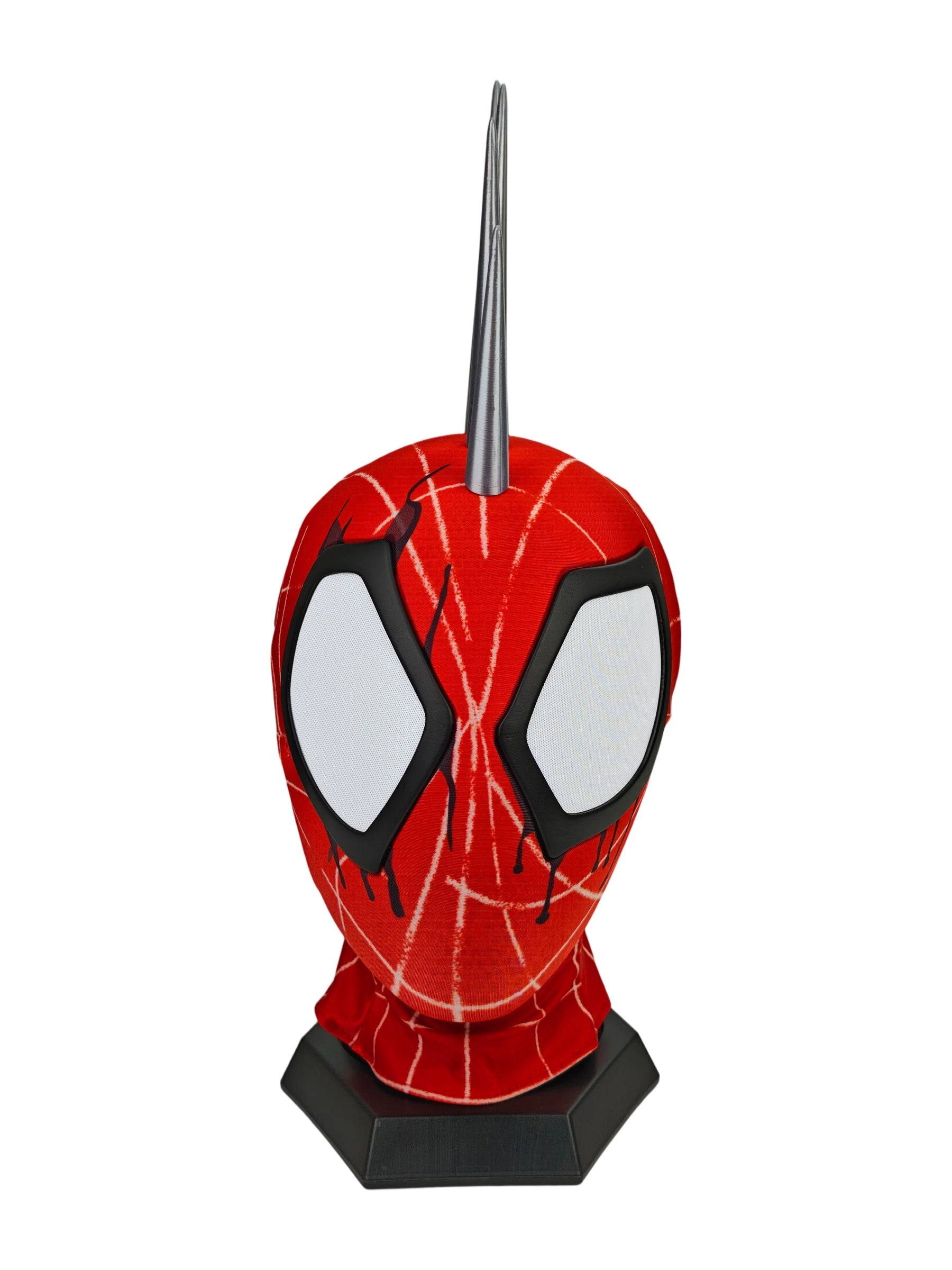 A red and black Punk Spider mask displayed on a black stand against a plain white background.