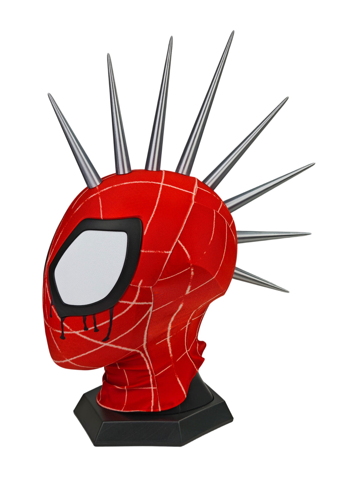 A red and black Punk Spider mask displayed on a black stand, with multiple sharp silver spikes rising from the top, photographed on a plain white background.