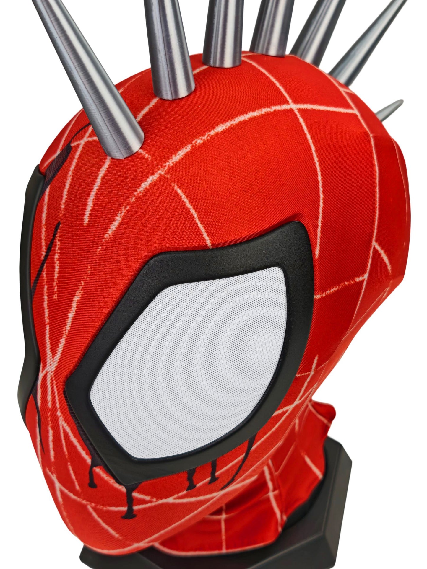 Punk Spider mask hood with white web-line graphics and multiple metallic spikes on top, displayed on a black stand against a plain white background.