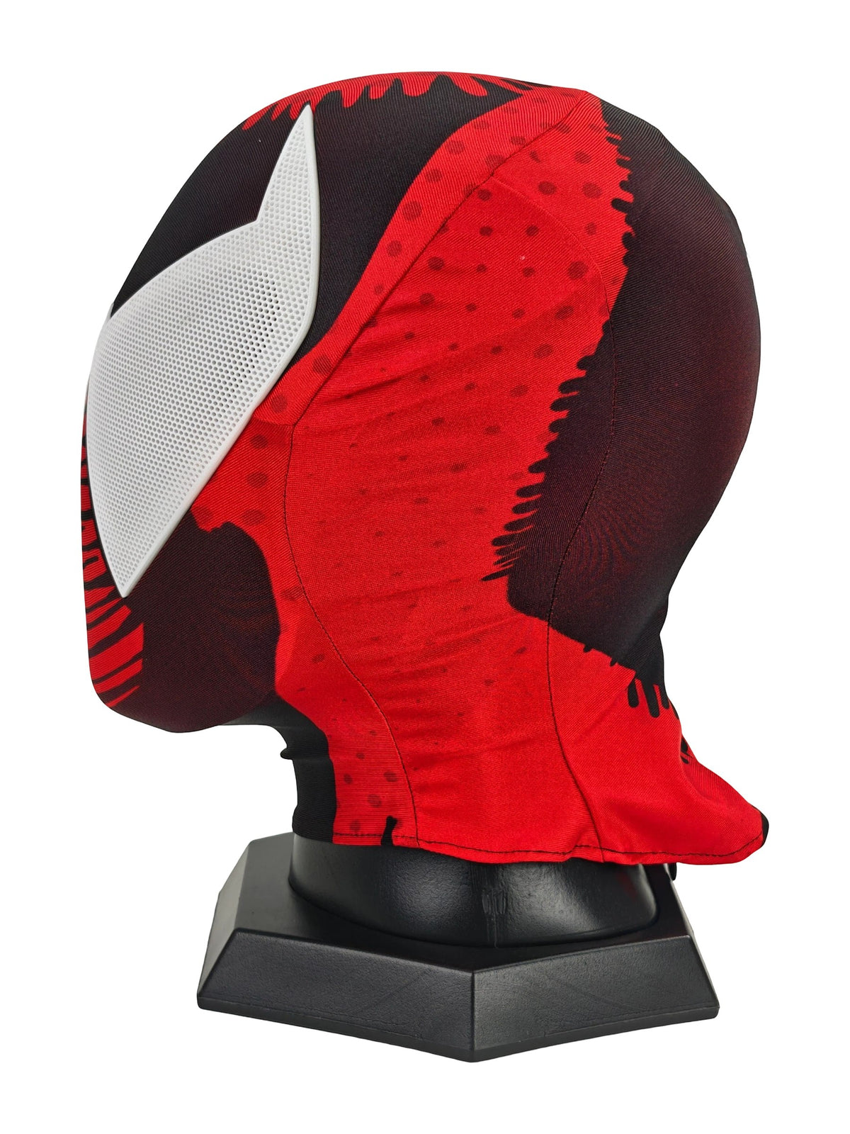 Side profile of Scarlet Spider-Man cosplay mask showing red printed fabric, black panels, and white eye lens