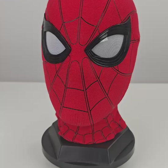 Spider-Man Homecoming mask video preview with red textured fabric, black eye frames, white mesh lenses, and black stand