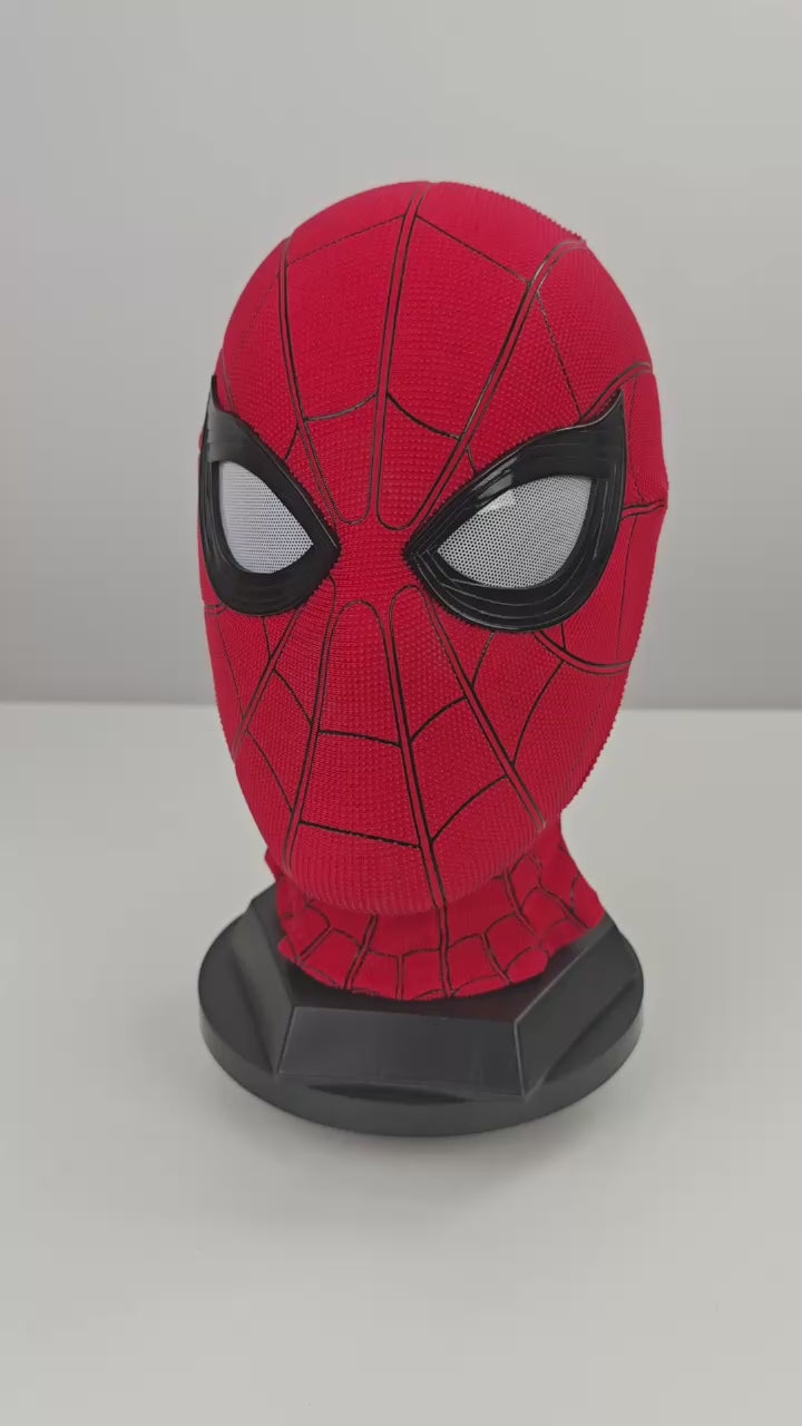 Spider-Man Homecoming mask video preview with red textured fabric, black eye frames, white mesh lenses, and black stand